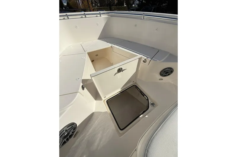Slide: The Image of 2022 Cobia 262 Center Console boat interior with open storage compartments. - 18