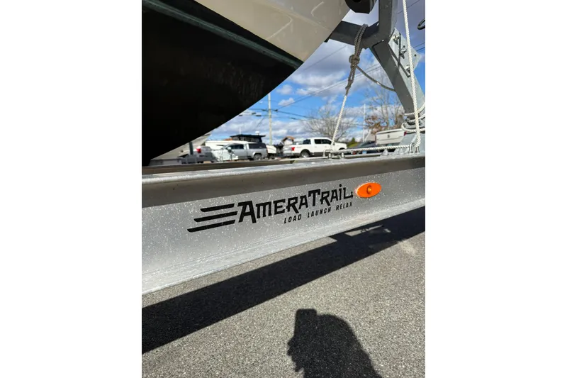 Slide: The Image of Trailer for 2022 Cobia 262 Center Console boat, AmeraTrail branding visible. - 4