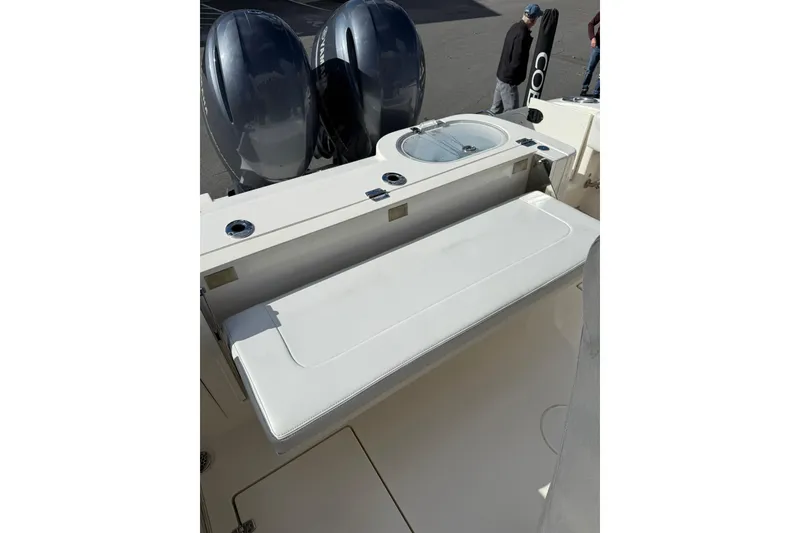 Slide: The Image of 2022 Cobia 262 Center Console boat with dual engines and seating area. - 8
