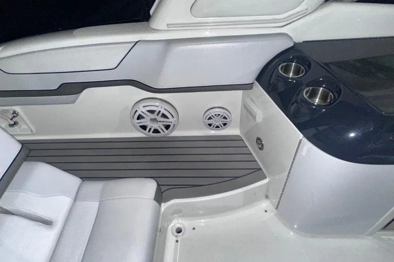 Slide: The Image of Interior of a 2016 Formula 350 Sun Sport boat with speakers and cup holders. - 11