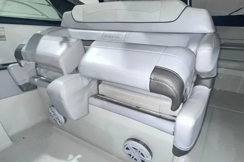 Slide: The Image of 2016 Formula 350 Sun Sport interior seating with white upholstery and carbon accents. - 20