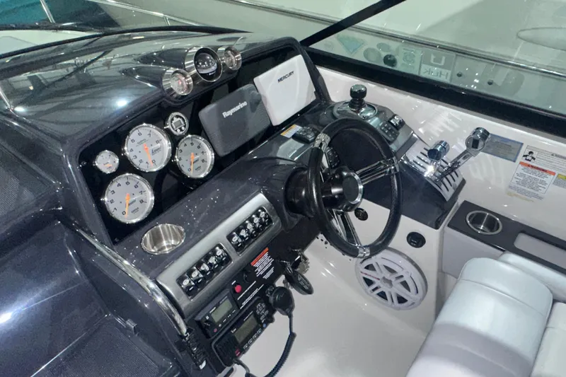 Slide: The Image of 2016 Formula 350 Sun Sport dashboard with gauges, steering wheel, and controls. - 22