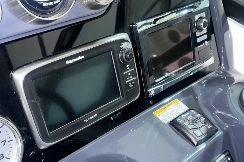 Slide: The Image of Dashboard of a 2016 Formula 350 Sun Sport with Raymarine electronics. - 25