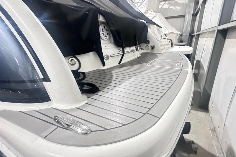 Slide: The Image of 2016 Formula 350 Sun Sport boat in storage, showcasing sleek design and spacious deck. - 3