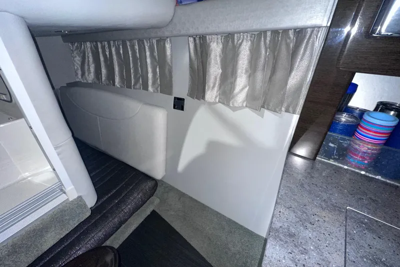 Slide: The Image of Interior of 2016 Formula 350 Sun Sport boat with curtains and seating area. - 32