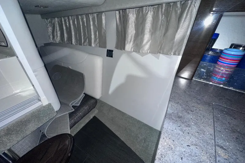 Slide: The Image of Interior cabin of 2016 Formula 350 Sun Sport boat with curtains and seating area. - 40