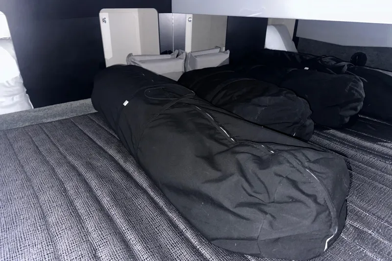 Slide: The Image of Interior storage area of a 2016 Formula 350 Sun Sport boat with black bags. - 42