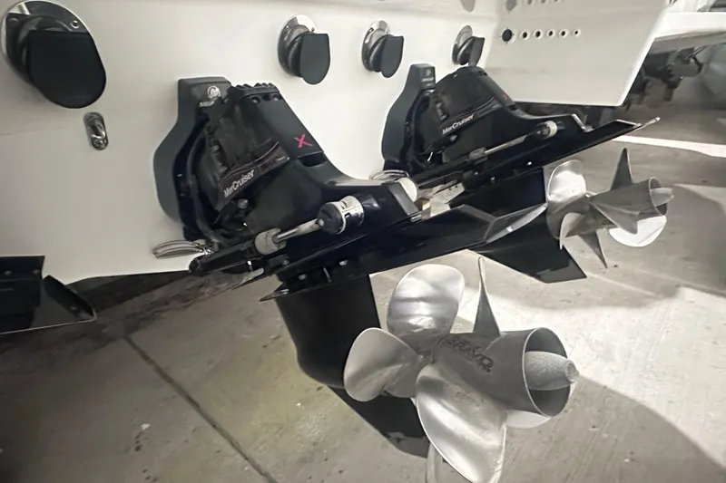 Slide: The Image of 2016 Formula 350 Sun Sport boat with dual MerCruiser outdrives and stainless steel propellers. - 47