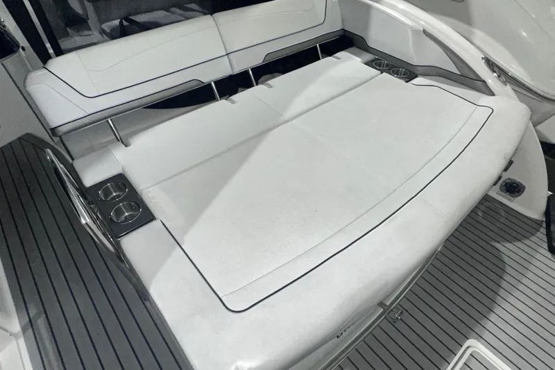 Slide: The Image of 2016 Formula 350 Sun Sport boat interior with white seating and cup holders. - 7