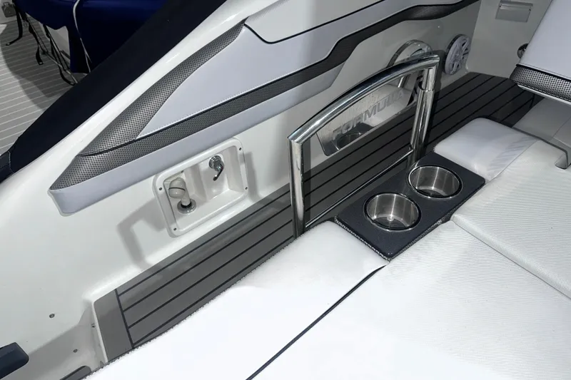 Slide: The Image of 2016 Formula 350 Sun Sport boat interior with cup holders and sleek design. - 9