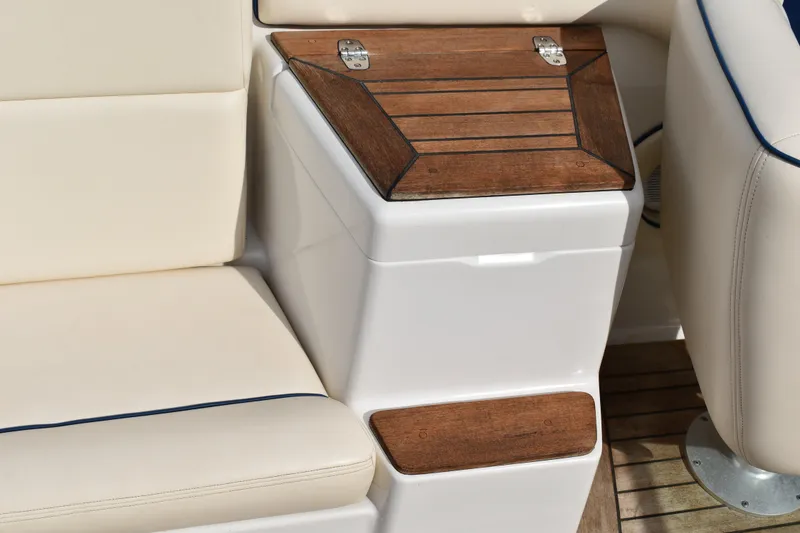 Slide: The Image of 2003 Chris-Craft Launch 25 interior with beige seating and wooden accents. - 17
