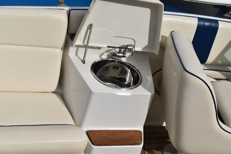 Slide: The Image of 2003 Chris-Craft Launch 25 boat interior with sink and seating. - 18
