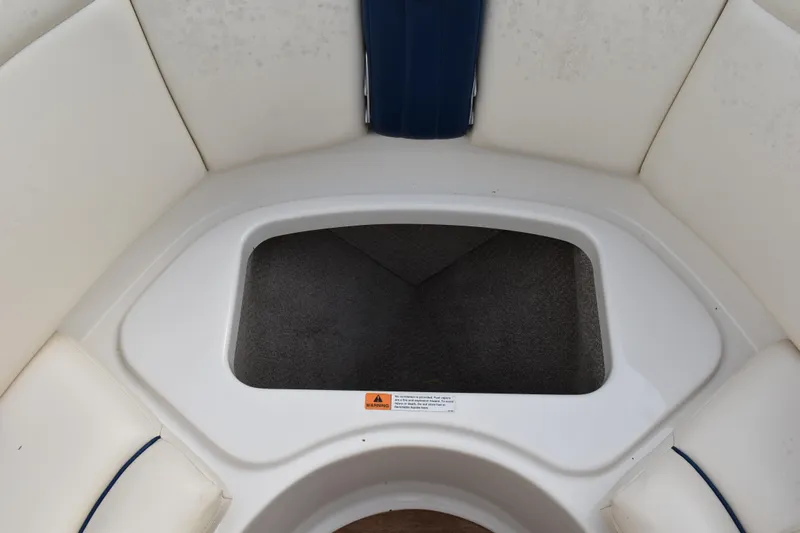 Slide: The Image of 2003 Chris-Craft Launch 25 boat interior seating with storage compartment. - 33