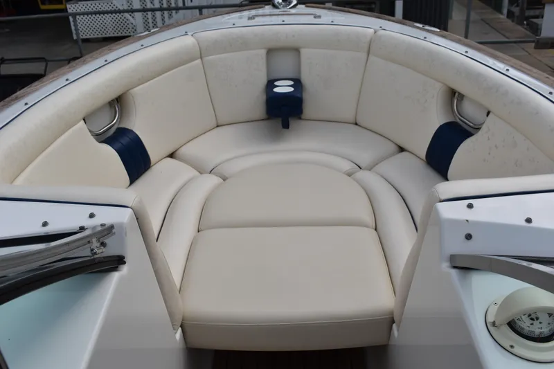 Slide: The Image of 2003 Chris-Craft Launch 25 boat interior with cream leather seating and cup holders. - 36