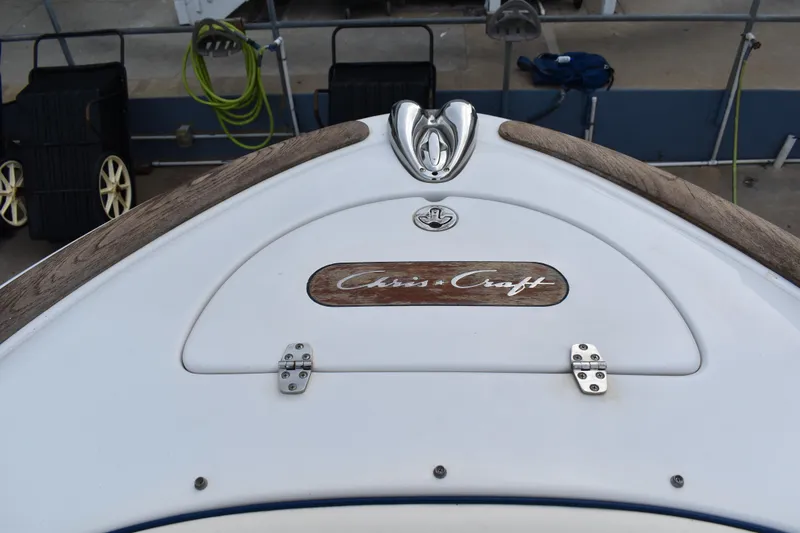 Slide: The Image of 2003 Chris-Craft Launch 25 boat deck with logo and wood accents. - 37