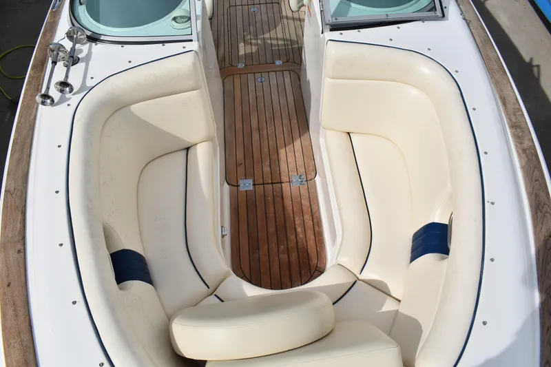 Slide: The Image of 2003 Chris-Craft Launch 25 boat interior with teak flooring and cream seating. - 38