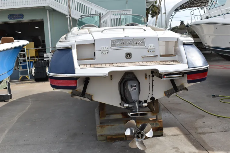 Slide: The Image of 2003 Chris-Craft Launch 25 boat on display, showcasing rear view and propeller. - 7