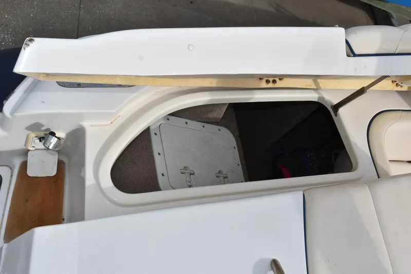 Slide: The Image of Open storage compartment on a 2003 Chris-Craft Launch 25 boat. - 9