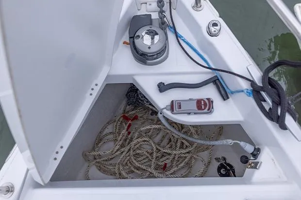 Slide: The Image of Anchor locker of 2020 Jeanneau Sun Odyssey 410 with ropes and winch. - 2