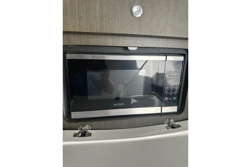 Slide: The Image of Built-in microwave in 2021 Intrepid 409 Valor boat interior. - 14