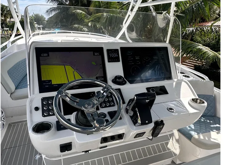 Slide: The Image of 2021 Intrepid 409 Valor helm with dual screens and modern controls. - 16