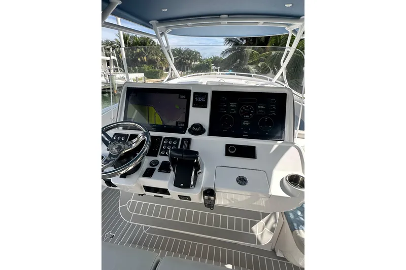 Slide: The Image of 2021 Intrepid 409 Valor helm with advanced navigation displays and controls. - 17