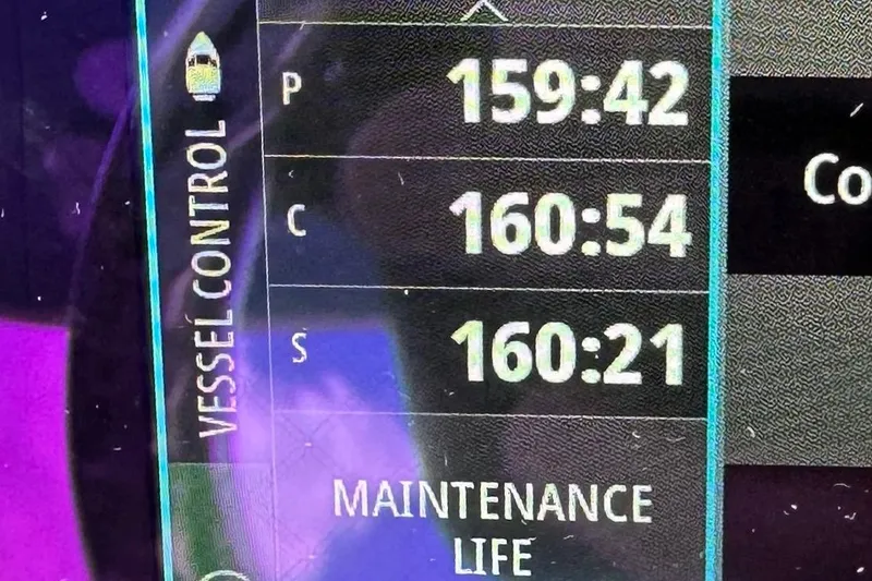 Slide: The Image of Vessel control display on 2021 Intrepid 409 Valor showing maintenance life hours. - 21