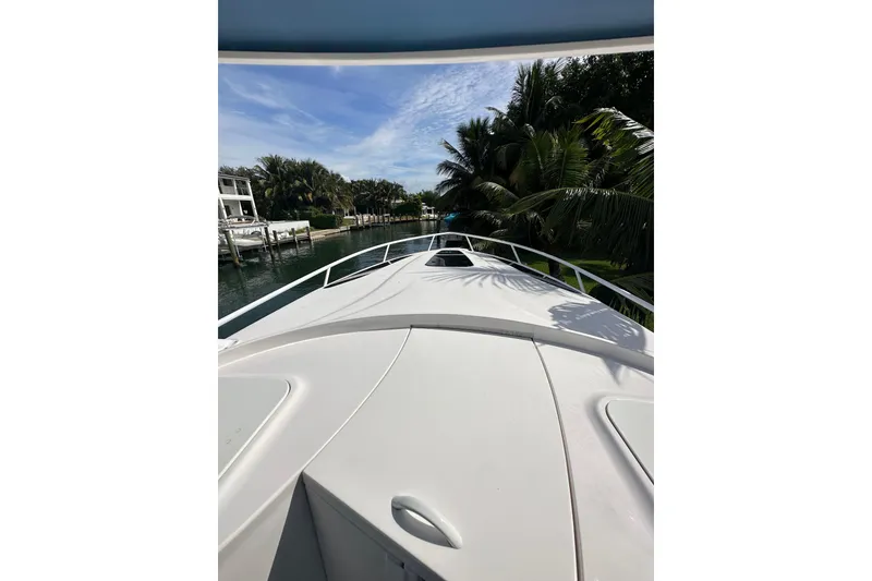 Slide: The Image of 2021 Intrepid 409 Valor boat deck view with tropical surroundings. - 23