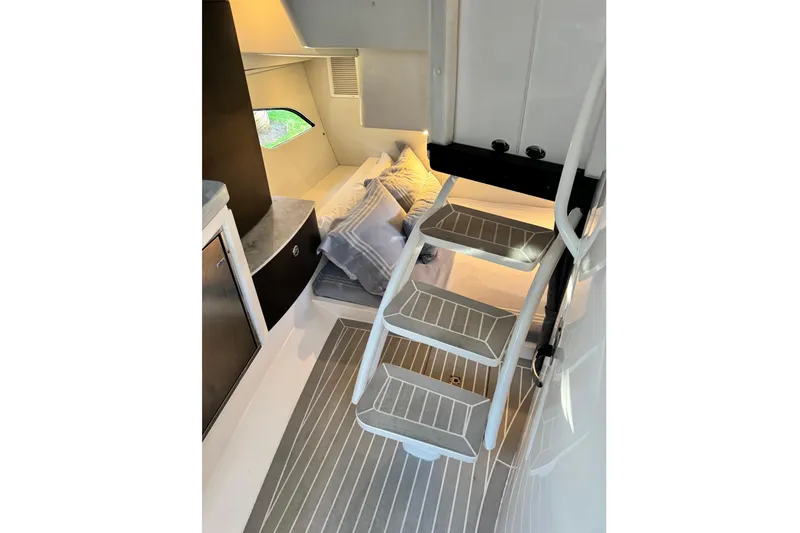 Slide: The Image of Interior cabin of 2021 Intrepid 409 Valor with stairs and cozy bedding. - 25