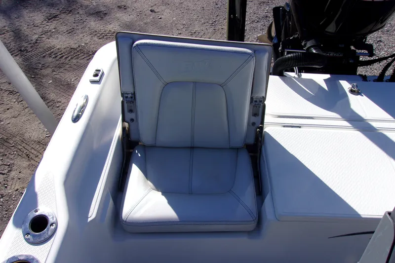 Slide: The Image of 2017 Blue Wave 2200 PureBay boat seat with white upholstery and cup holder. - 12