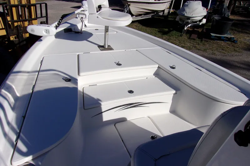 Slide: The Image of 2017 Blue Wave 2200 PureBay boat interior with white seating and storage compartments. - 14