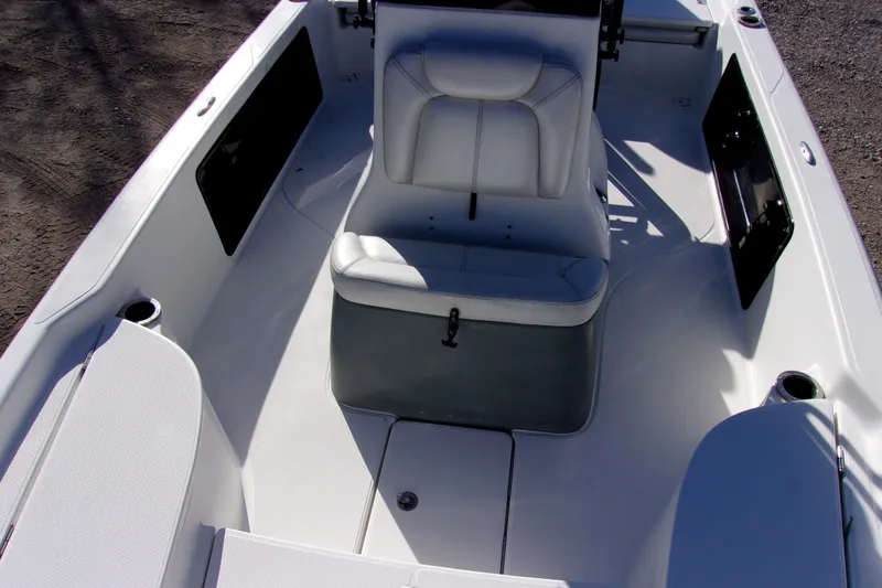 Slide: The Image of 2017 Blue Wave 2200 PureBay boat interior with white seating and storage compartments. - 15