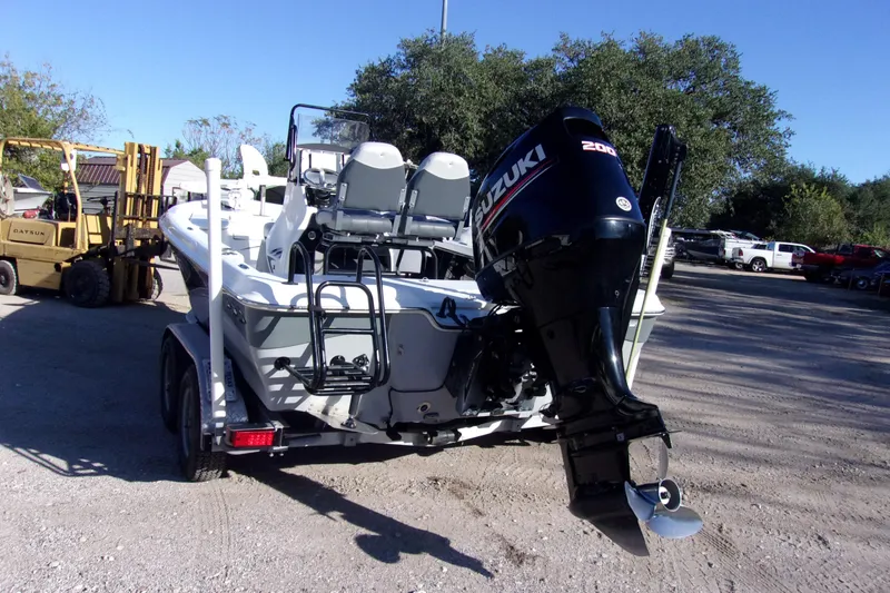 Slide: The Image of 2017 Blue Wave 2200 PureBay boat with Suzuki outboard motor on a trailer. - 3