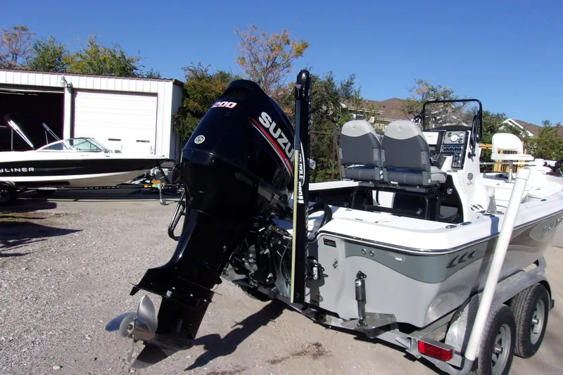 Slide: The Image of 2017 Blue Wave 2200 PureBay boat with Suzuki outboard motor on trailer. - 4