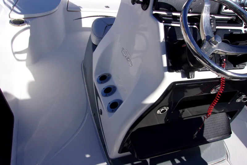 Slide: The Image of 2017 Blue Wave 2200 PureBay boat console with steering wheel and control panel. - 8