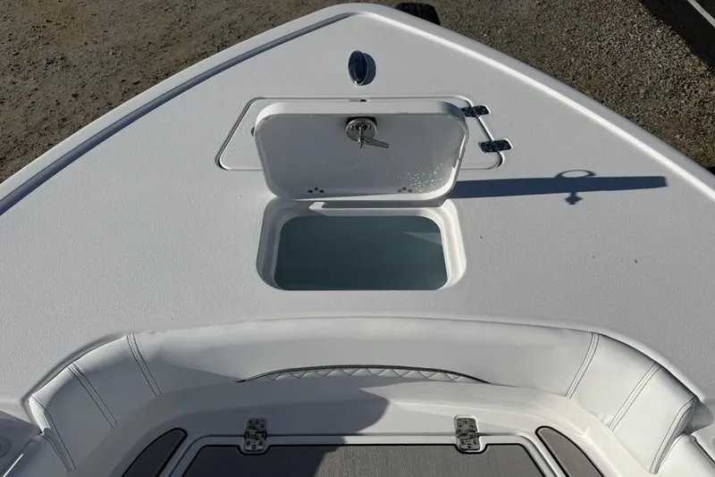 Slide: The Image of 2026 Sportsman Masters 247OE Bay Boat deck with open storage compartment. - 12