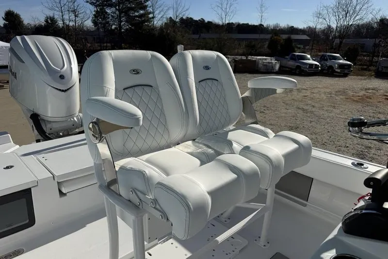 Slide: The Image of Luxurious seating on 2026 Sportsman Masters 247OE Bay Boat with white leather upholstery. - 14