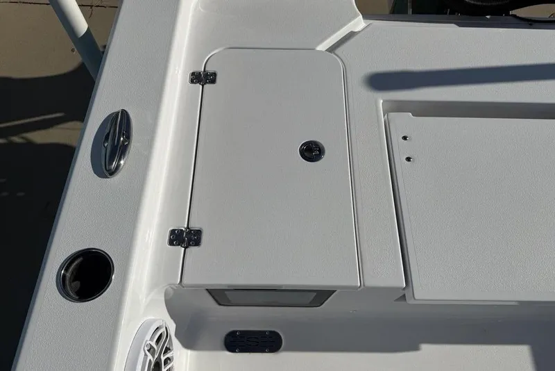 Slide: The Image of 2026 Sportsman Masters 247OE Bay Boat deck with storage compartment and speaker. - 31
