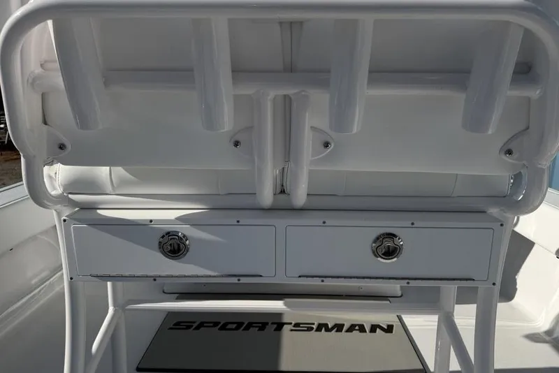 Slide: The Image of 2026 Sportsman Masters 247OE Bay Boat interior with storage compartments and rod holders. - 32