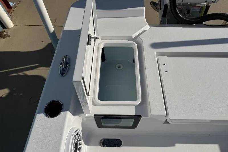 Slide: The Image of 2026 Sportsman Masters 247OE Bay Boat deck with open storage compartment. - 33