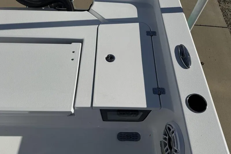 Slide: The Image of 2026 Sportsman Masters 247OE Bay Boat deck with storage compartments and speaker. - 34