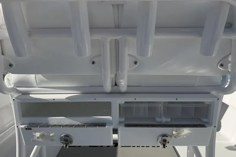 Slide: The Image of 2026 Sportsman Masters 247OE Bay Boat storage compartments and rod holders. - 39