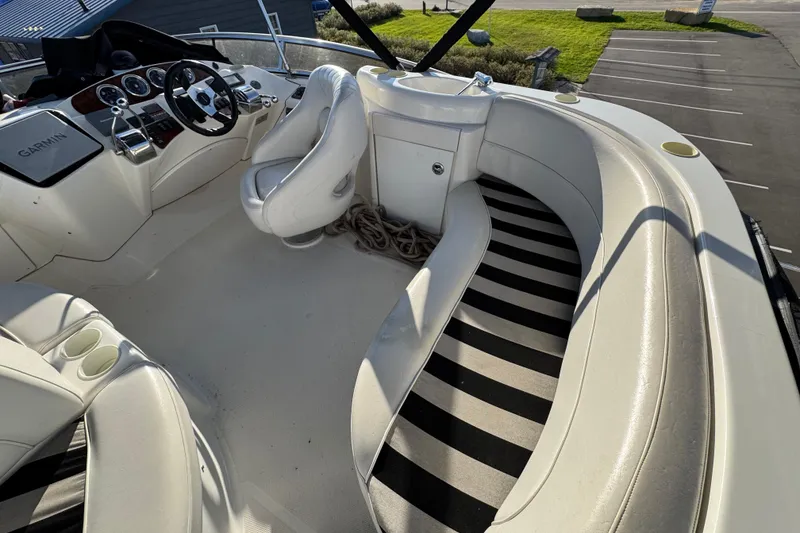 Slide: The Image of 2005 Meridian 368 Motoryacht helm with white seating and Garmin navigation system. - 15