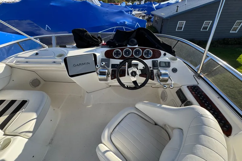 Slide: The Image of 2005 Meridian 368 Motoryacht helm with Garmin navigation system and luxurious seating. - 17