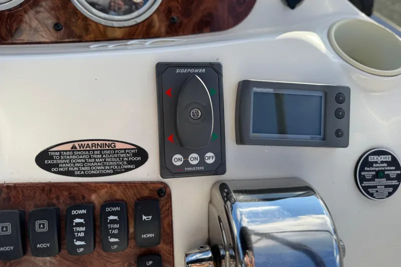Slide: The Image of Control panel of a 2005 Meridian 368 Motoryacht with navigation and safety features. - 19