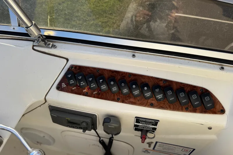 Slide: The Image of Control panel of a 2005 Meridian 368 Motoryacht with various switches and buttons. - 20