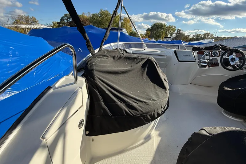 Slide: The Image of 2005 Meridian 368 Motoryacht helm with covered seats and Garmin navigation system. - 26