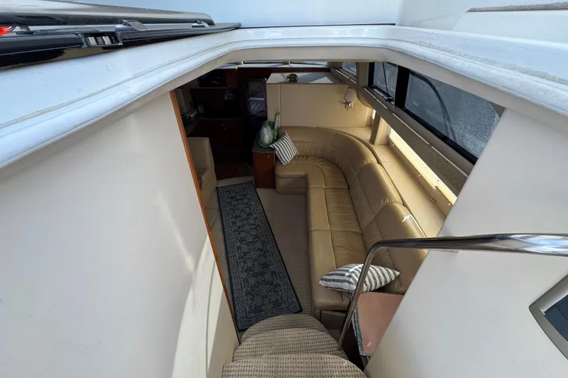 Slide: The Image of Interior of 2005 Meridian 368 Motoryacht with beige leather seating and striped cushions. - 30