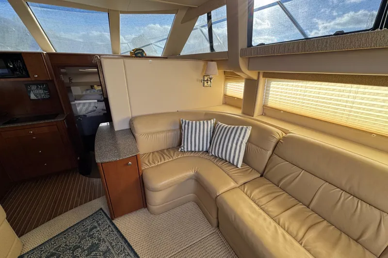 Slide: The Image of Luxurious interior of 2005 Meridian 368 Motoryacht with leather seating and striped cushions. - 32