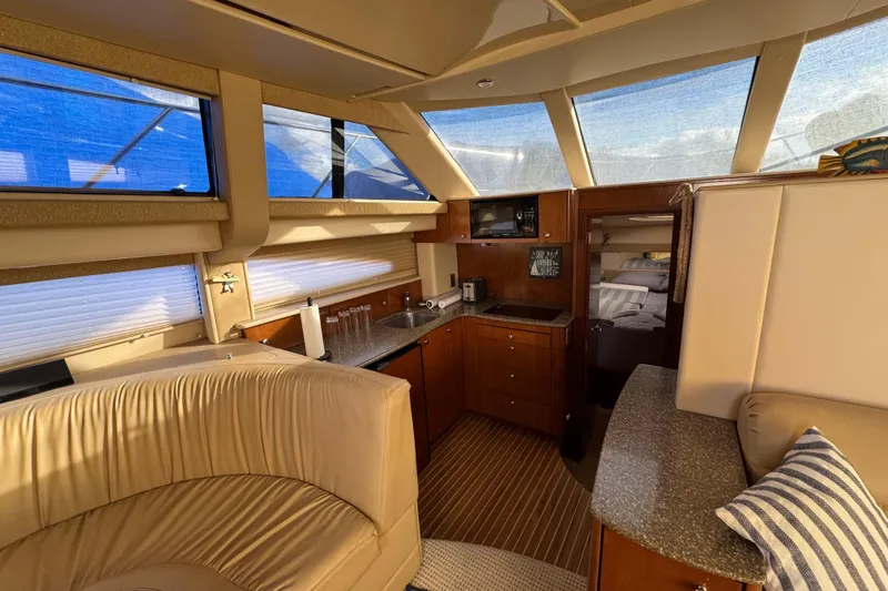 Slide: The Image of Luxurious interior of 2005 Meridian 368 Motoryacht with kitchen and seating area. - 36